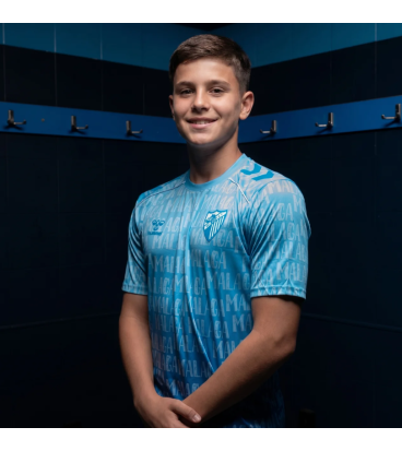 MALAGA CF OFFICIAL PREMATCH LETTERED T‑SHIRT 2025/26 –JUNIOR–