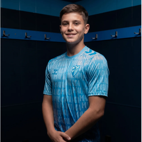MALAGA CF OFFICIAL PREMATCH LETTERED T‑SHIRT 2025/26 –JUNIOR–