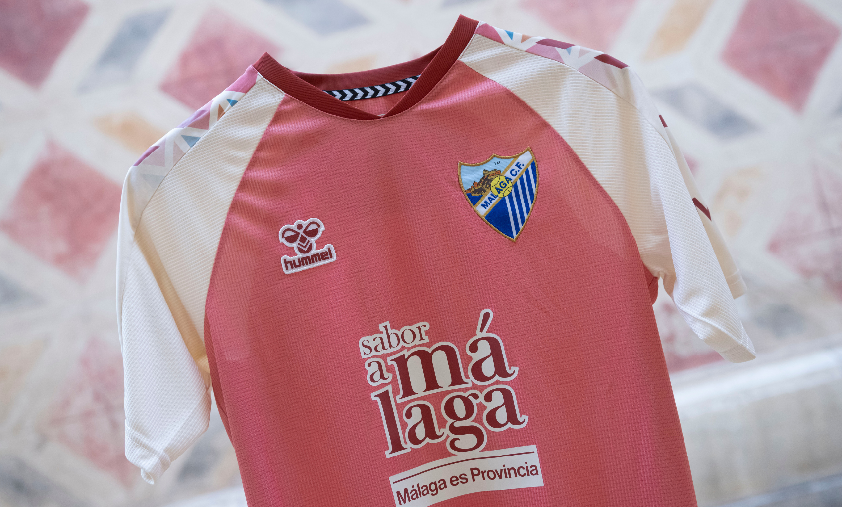 https://www.tiendamalagacf.com/es/equipaciones/716-2172-camiseta-oficial-2-equipacion-malaga-cf-202627.html#/4-talla_camiseta_short_juego_adulto-l